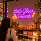 Let's Glow Diwali neon sign shop display with customer